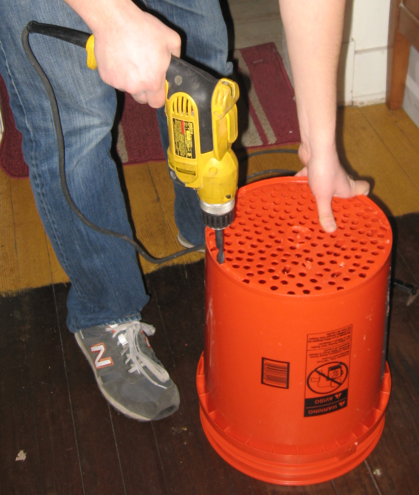 holes being drilled into bucket
