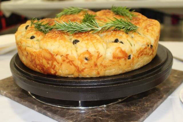 olive cheese bread cooked in a Dutch oven