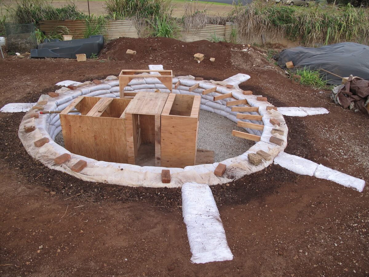 earthbag dome wall with supports for bench