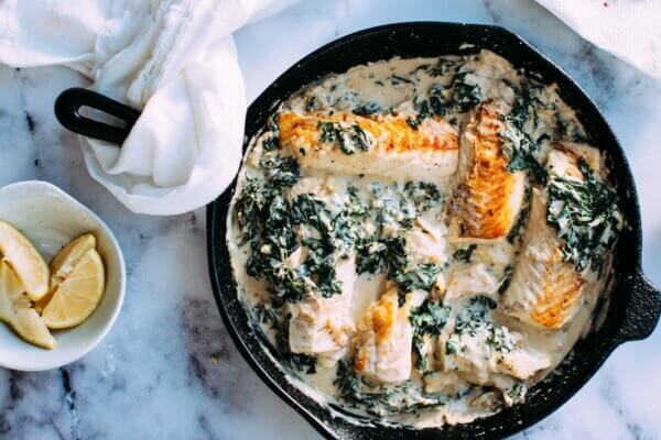 salmon and greens in a cast iron pan