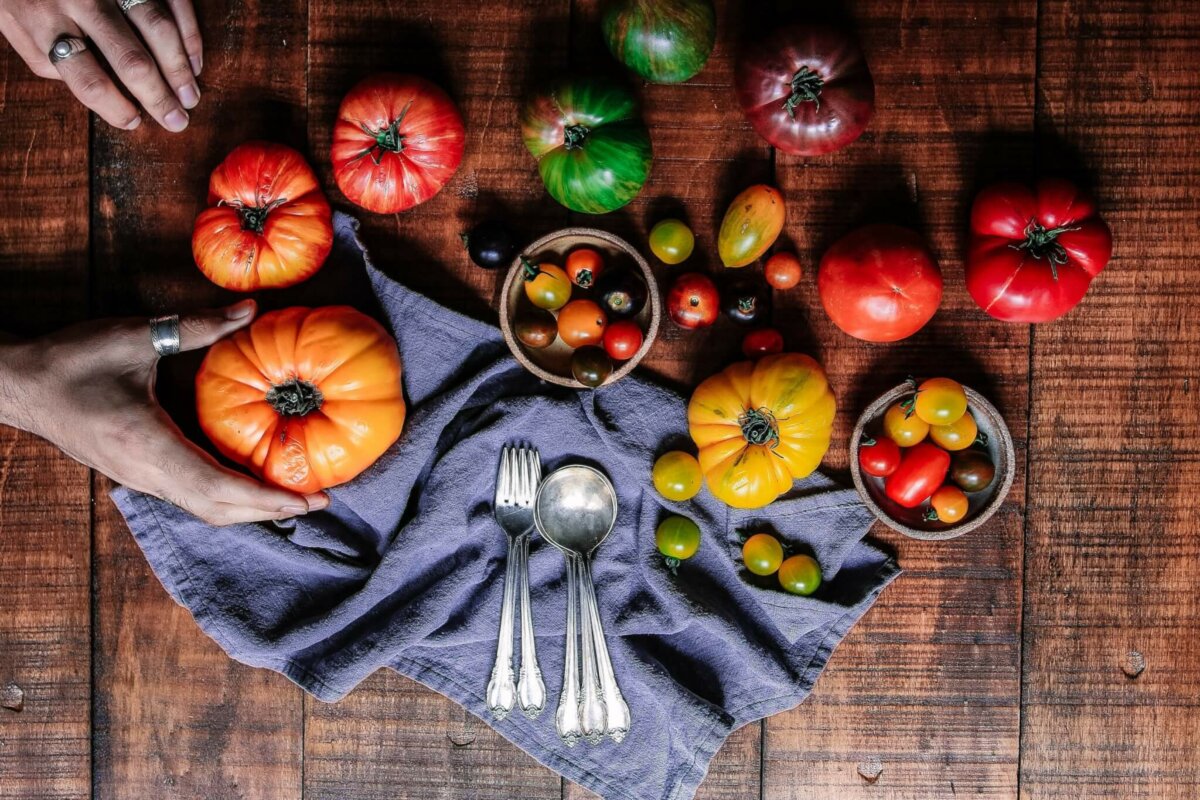 tomatoes on table with utensils