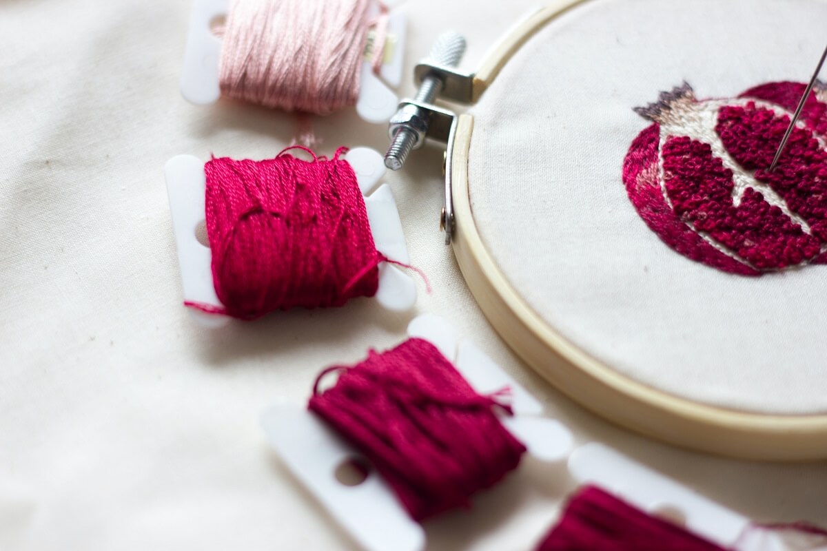 embroidery hoop and pomegranate